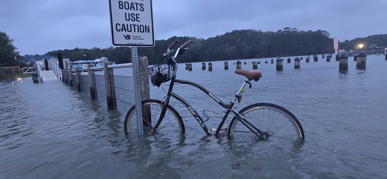 A bike riding through floodwater at Owl Creek during the first nor’easter of the season