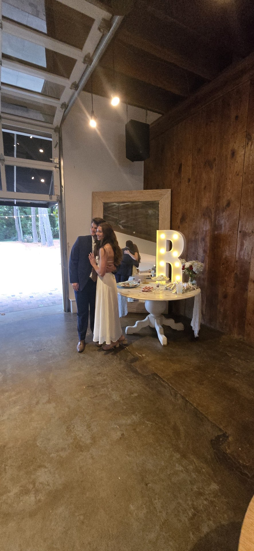 Bride and groom silhouette by the monogrammed cake table Bride and groom silhouette by the monogrammed cake table