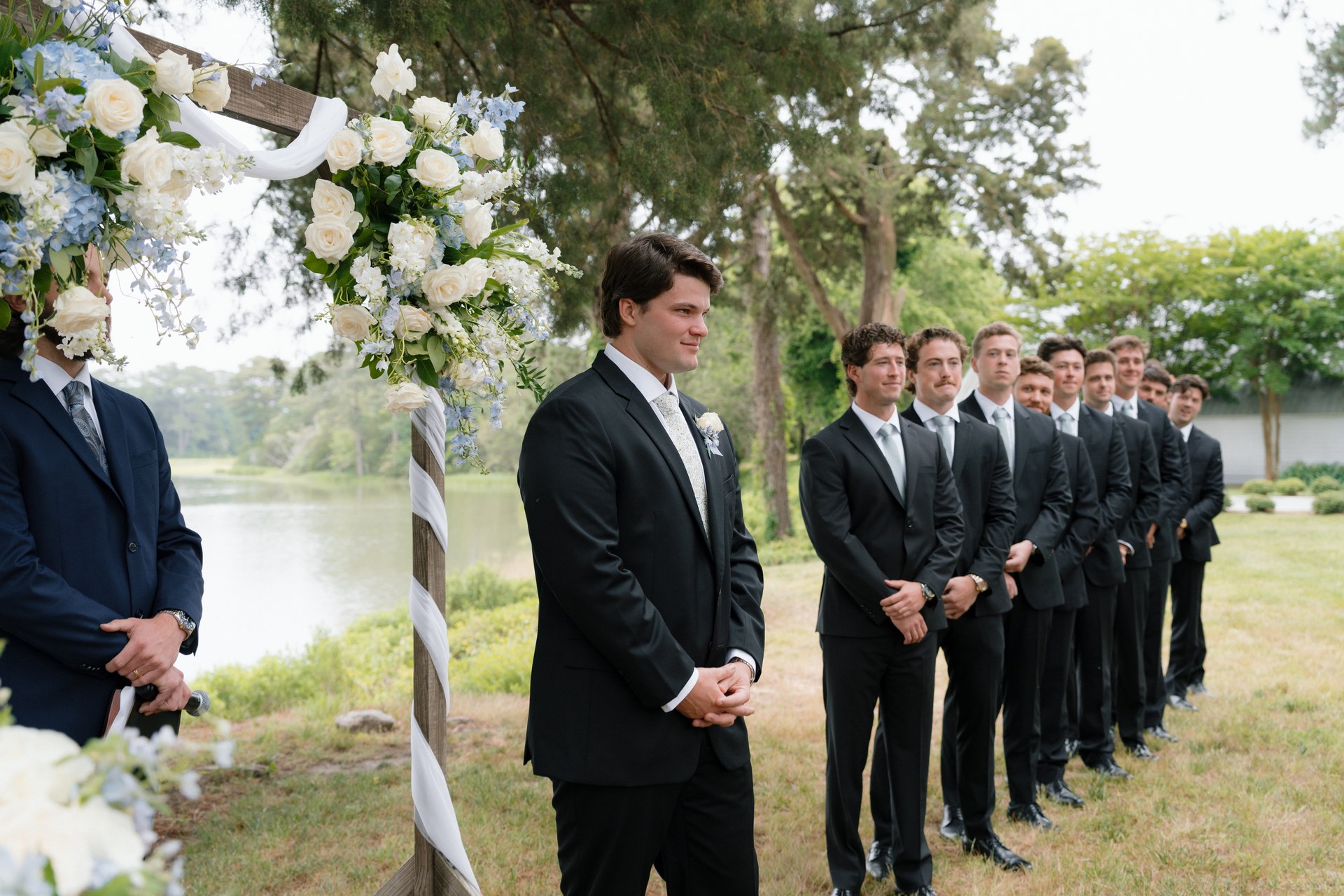 Groomsmen waiting by the water in the fog Groomsmen waiting by the water in the fog