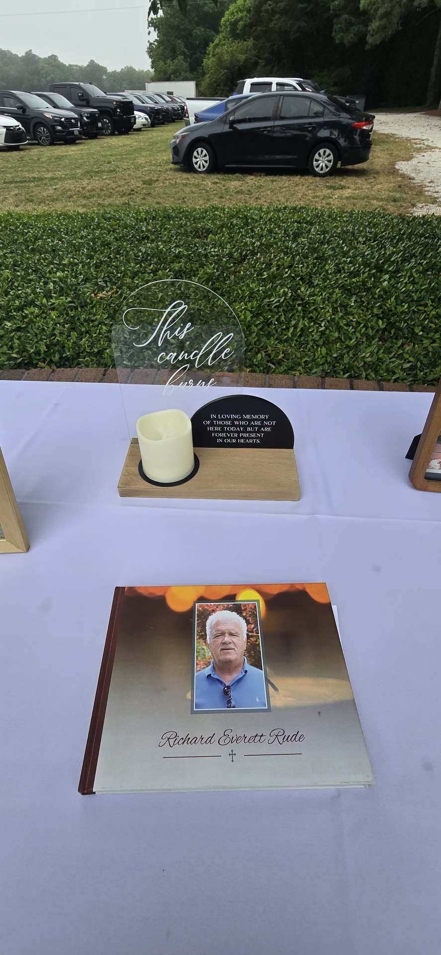 A memory table with photos of loved ones who could not attend A memory table with photos of loved ones who could not attend