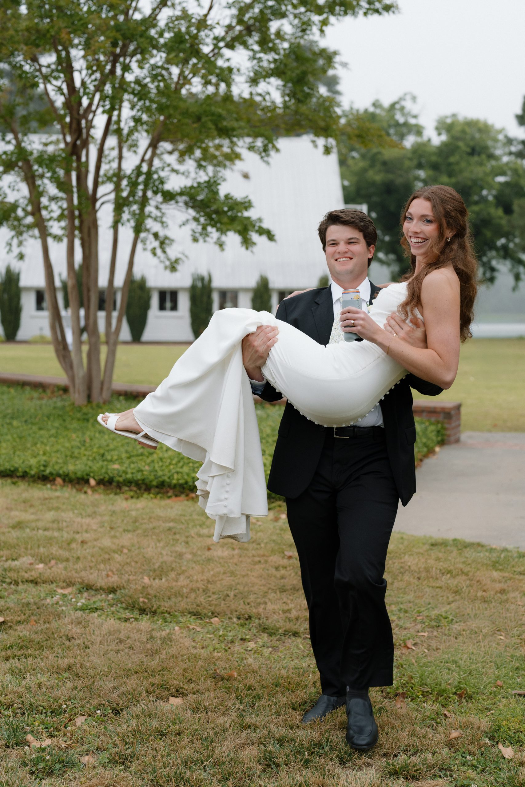 Noah lifting Tara up laughing at the reception Noah lifting Tara up laughing at the reception