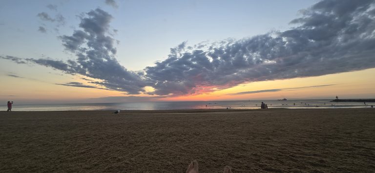Bare feet in the sand at sunrise on the Virginia Beach oceanfront